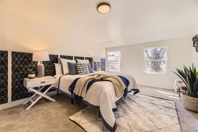 carpeted bedroom with vaulted ceiling