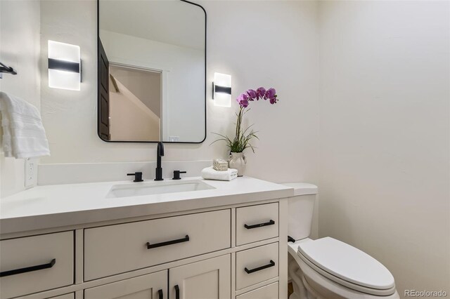 bathroom with vanity and toilet