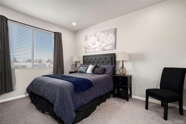 bedroom featuring light carpet