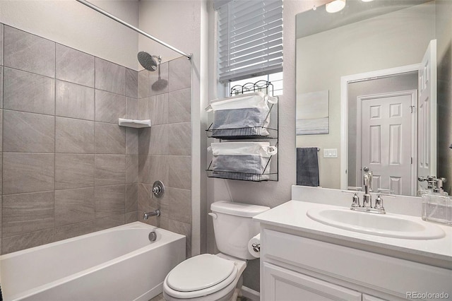 full bathroom with vanity, toilet, and tiled shower / bath