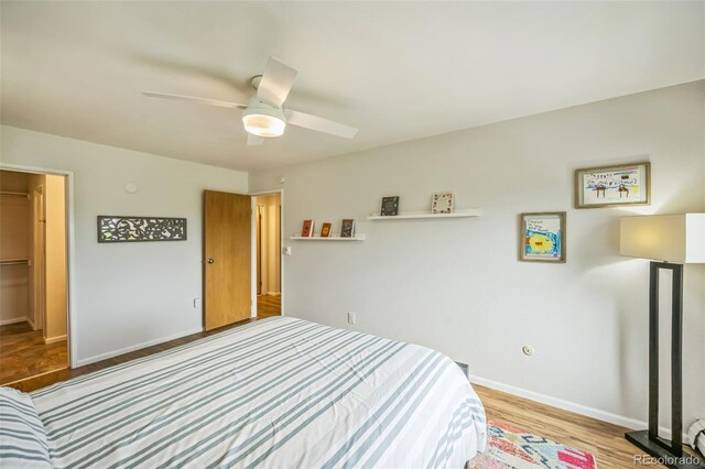 3240 Iris Ave Unit G409, Boulder, CO 80301 - bedroom with wood finished floors, baseboards, and a ceiling fan