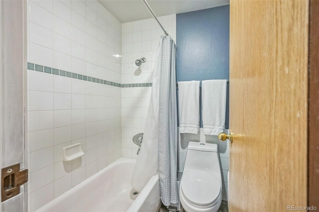 3240 Iris Ave Unit G409, Boulder, CO 80301 - bathroom with shower / bath combo with shower curtain, toilet, and a textured wall