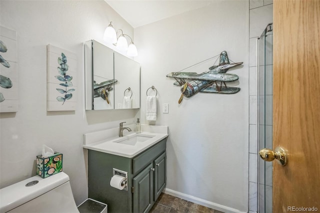 3240 Iris Ave Unit G409, Boulder, CO 80301 - bathroom with toilet, vanity, baseboards, and a shower