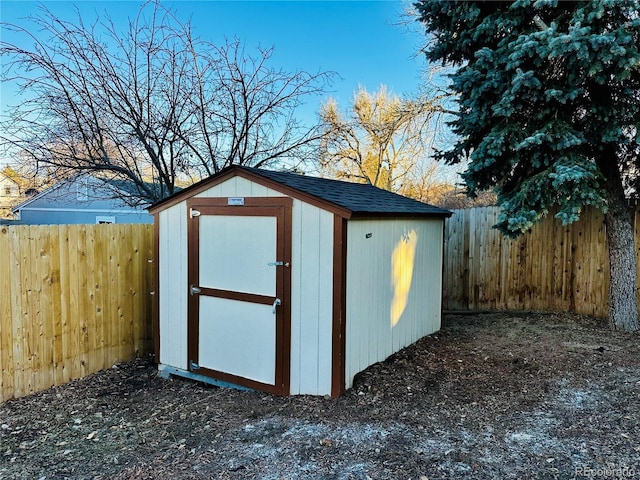 view of shed featuring a fenced backyard