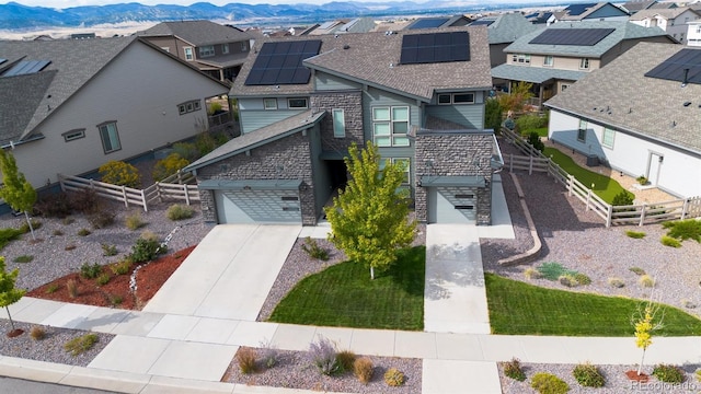 birds eye view of property featuring a mountain view