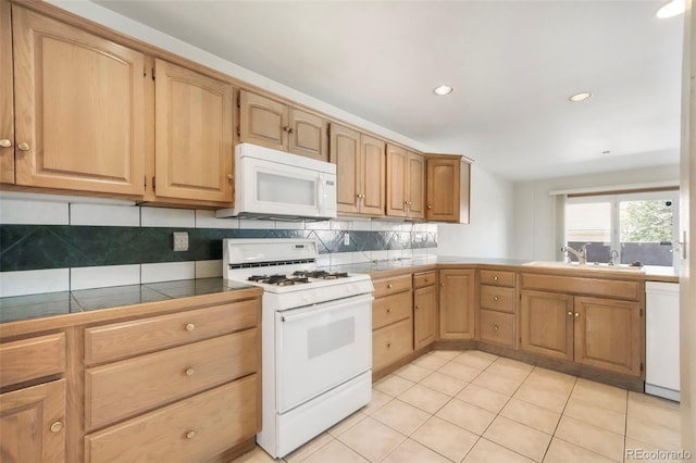 174 Luxury Ln, Colorado Springs, CO 80921 - kitchen with white appliances, tile counters, tasteful backsplash, light tile patterned floors, and recessed lighting