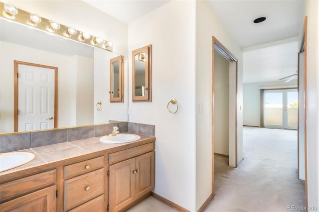 174 Luxury Ln, Colorado Springs, CO 80921 - bathroom with double vanity and baseboards