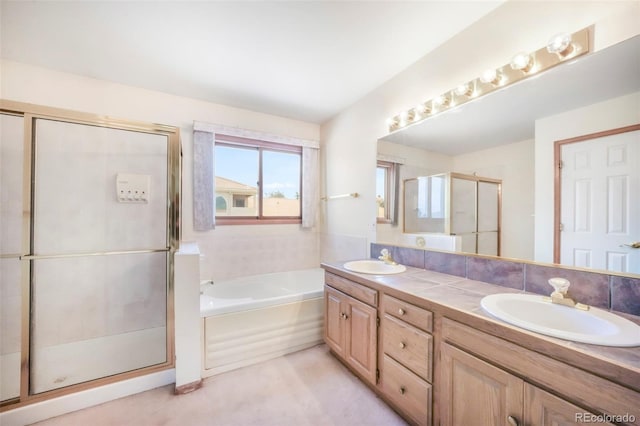 174 Luxury Ln, Colorado Springs, CO 80921 - full bath featuring double vanity, a shower stall, and a garden tub