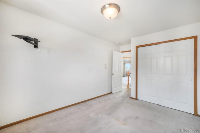 174 Luxury Ln, Colorado Springs, CO 80921 - unfurnished bedroom with a closet and light colored carpet