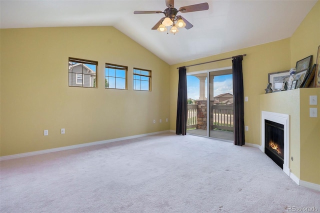 9311 Amison Cir Unit 204, Parker, CO 80134 - unfurnished living room with a ceiling fan, light colored carpet, a glass covered fireplace, and lofted ceiling