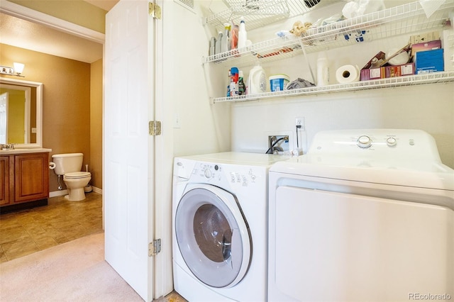 9311 Amison Cir Unit 204, Parker, CO 80134 - laundry area with washing machine and dryer, light colored carpet, and light tile patterned flooring