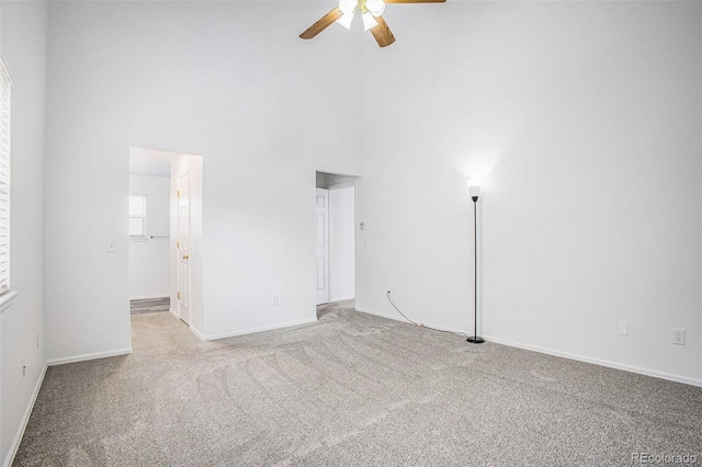 2870 Harrisburg Way, Colorado Springs, CO 80922 - carpeted empty room featuring a high ceiling, baseboards, and a ceiling fan