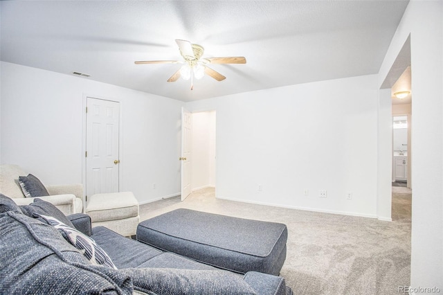 2870 Harrisburg Way, Colorado Springs, CO 80922 - carpeted living area featuring visible vents, baseboards, and a ceiling fan