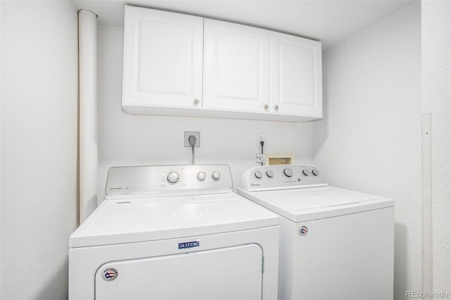 2870 Harrisburg Way, Colorado Springs, CO 80922 - washroom with washing machine and dryer and cabinet space