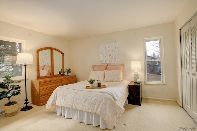 carpeted bedroom featuring a closet