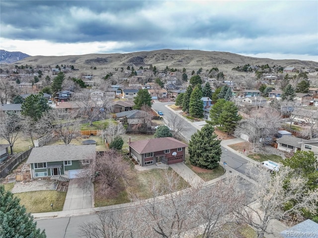 birds eye view of property featuring a mountain view and a residential view