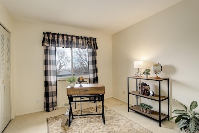 office with baseboards and carpet