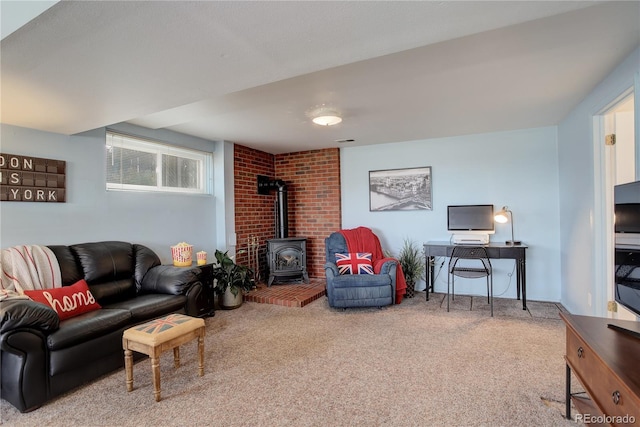 living room featuring visible vents, a wood stove, and carpet floors