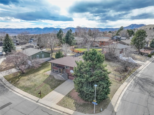 birds eye view of property featuring a mountain view and a residential view