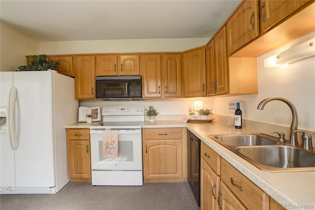 kitchen with black appliances, light countertops, and a sink