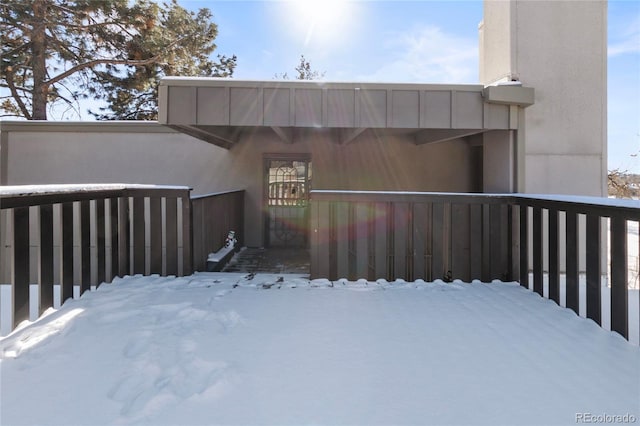 view of snow covered property entrance