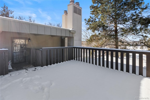 view of snow covered deck