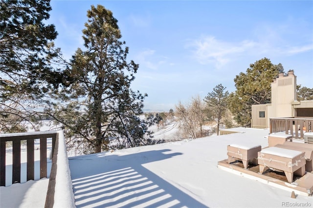 view of yard layered in snow