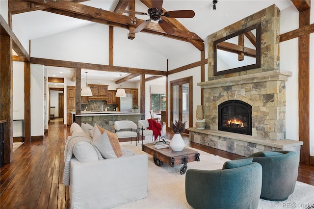 living room with high vaulted ceiling, ceiling fan, and dark hardwood / wood-style floors