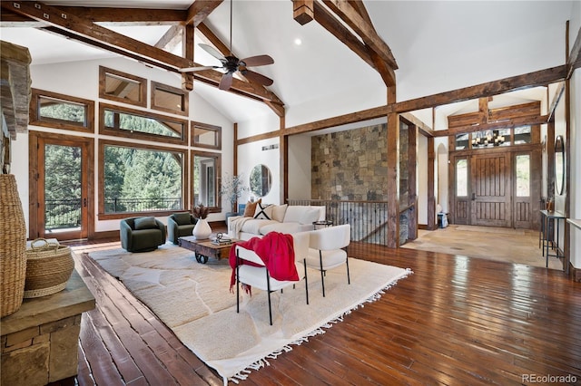 living room with a ceiling fan, high vaulted ceiling, hardwood / wood-style floors, and beamed ceiling