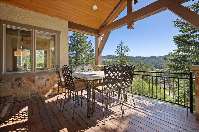 wooden terrace with a mountain view