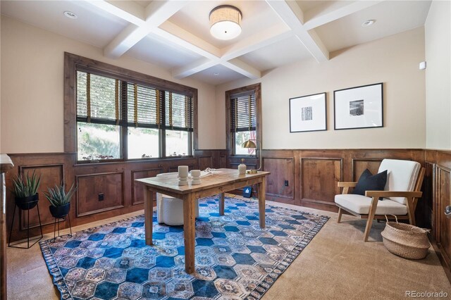 carpeted office space featuring coffered ceiling and beamed ceiling