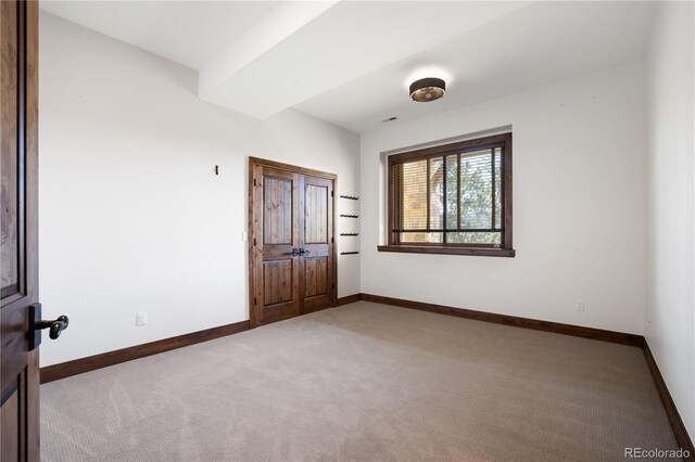 empty room featuring carpet floors