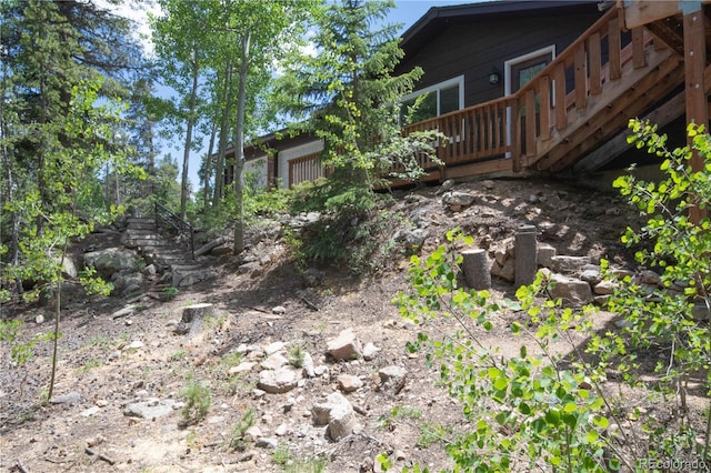 view of yard featuring a wooden deck