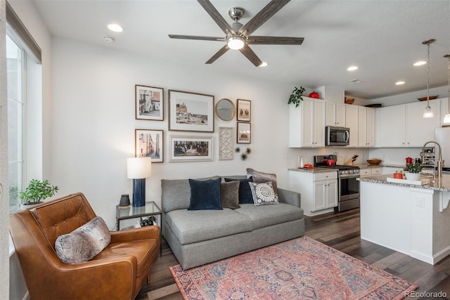 9250 Garnett Way Unit D, Arvada, CO 80007 - living area with ceiling fan, dark wood-type flooring, and recessed lighting