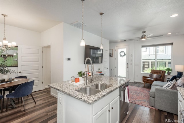 9250 Garnett Way Unit D, Arvada, CO 80007 - kitchen featuring dishwasher, open floor plan, dark wood-style floors, white cabinets, and a chandelier