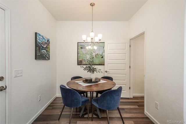 9250 Garnett Way Unit D, Arvada, CO 80007 - dining area featuring a chandelier and dark wood-type flooring