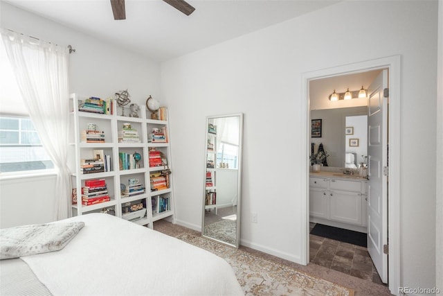 9250 Garnett Way Unit D, Arvada, CO 80007 - bedroom with multiple windows, ensuite bath, and carpet flooring