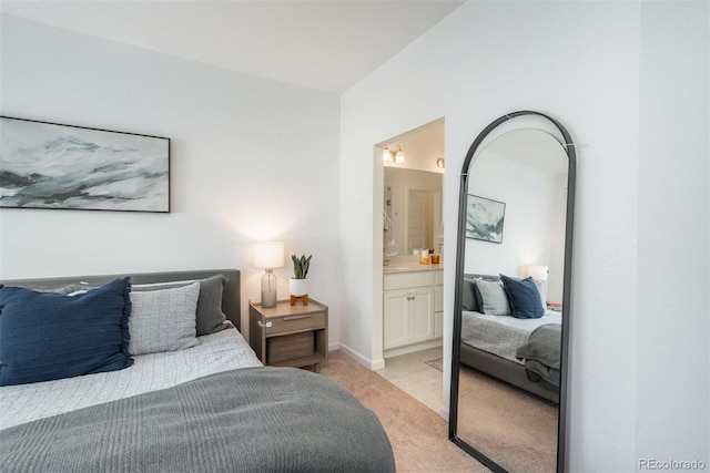 9250 Garnett Way Unit D, Arvada, CO 80007 - bedroom featuring light carpet and ensuite bathroom