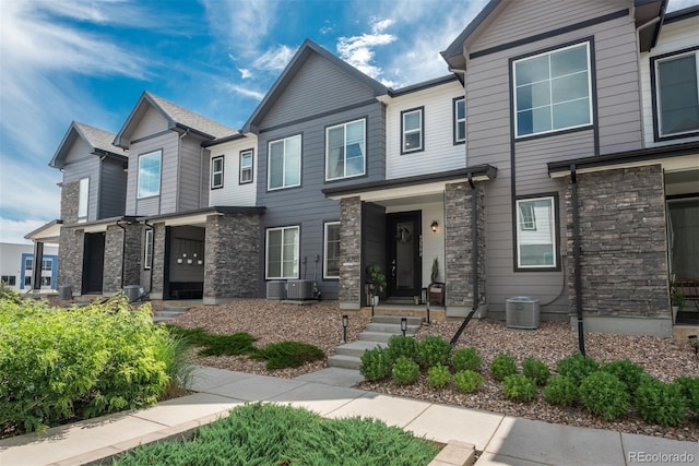9250 Garnett Way Unit D, Arvada, CO 80007 - townhome / multi-family property with stone siding