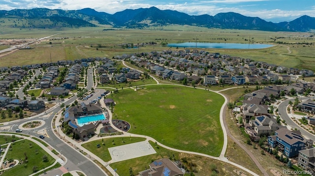 9250 Garnett Way Unit D, Arvada, CO 80007 - aerial view of property and surrounding area featuring a water and mountain view and nearby suburban area