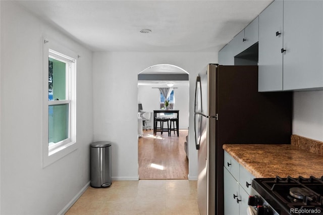 kitchen featuring black stove and light hardwood / wood-style floors