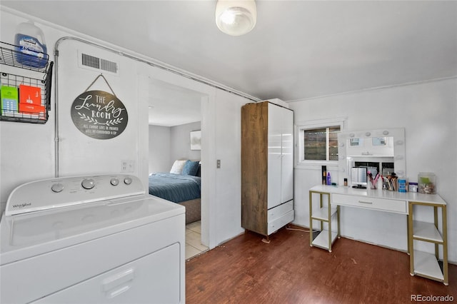 laundry room with dark hardwood / wood-style floors and washer / clothes dryer