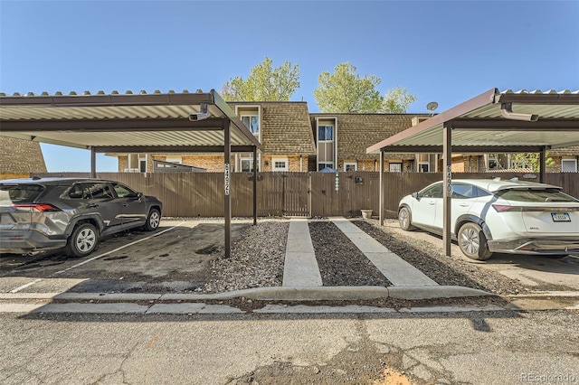 6492 Simms St Unit A, Arvada, CO 80004 - covered parking lot featuring a gate