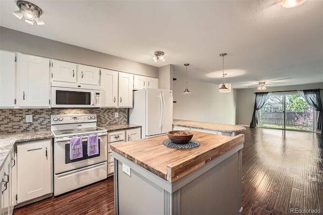 6492 Simms St Unit A, Arvada, CO 80004 - kitchen with white appliances, wooden counters, backsplash, open floor plan, and a kitchen island