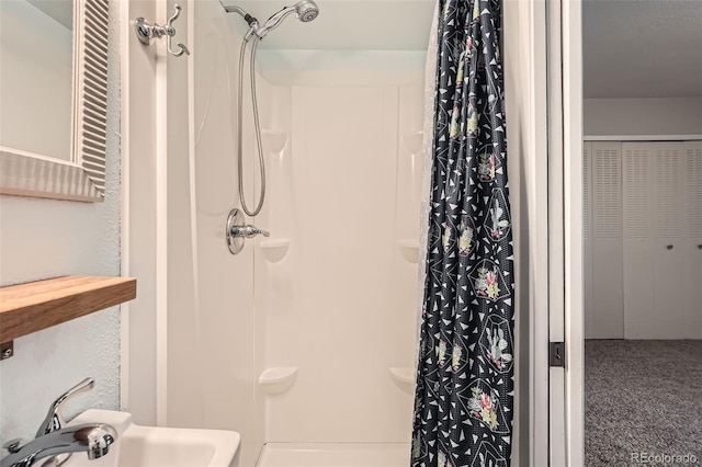 6492 Simms St Unit A, Arvada, CO 80004 - bathroom featuring a shower with shower curtain and a sink