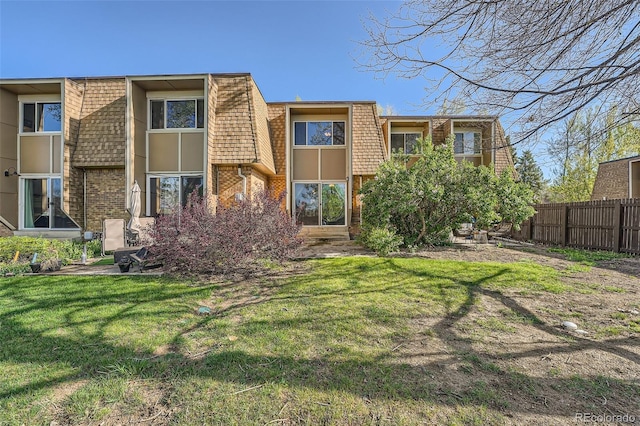 6492 Simms St Unit A, Arvada, CO 80004 - rear view of property featuring mansard roof and brick siding