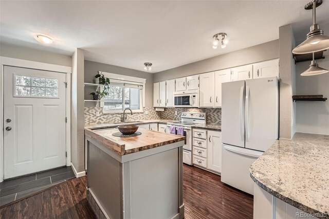 6492 Simms St Unit A, Arvada, CO 80004 - kitchen with white appliances, butcher block countertops, white cabinets, and backsplash
