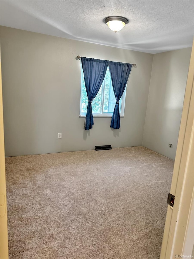 6492 Simms St Unit A, Arvada, CO 80004 - carpeted spare room featuring a textured ceiling