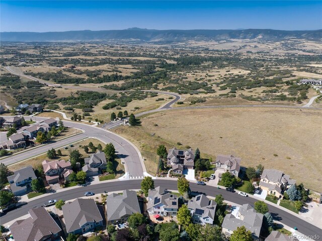 2880 Breezy Ln, Castle Rock, CO 80109 - aerial view of property and surrounding area featuring a mountainous background and nearby suburban area