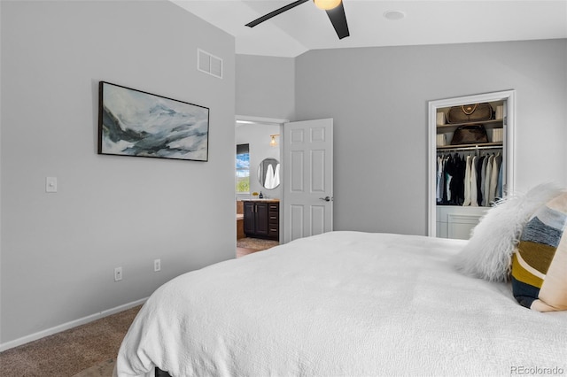 2880 Breezy Ln, Castle Rock, CO 80109 - bedroom with lofted ceiling, carpet, ensuite bath, baseboards, and a walk in closet